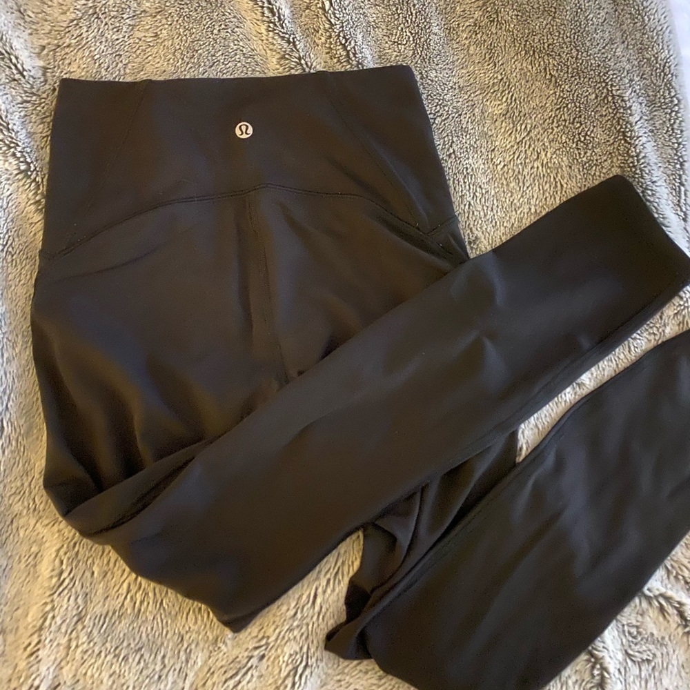 Black LULULEMON leggings with mesh on the sides